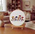 Children with umbrellas embroidery hoop art