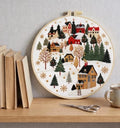 Snowy cottage village embroidery kit finished design
