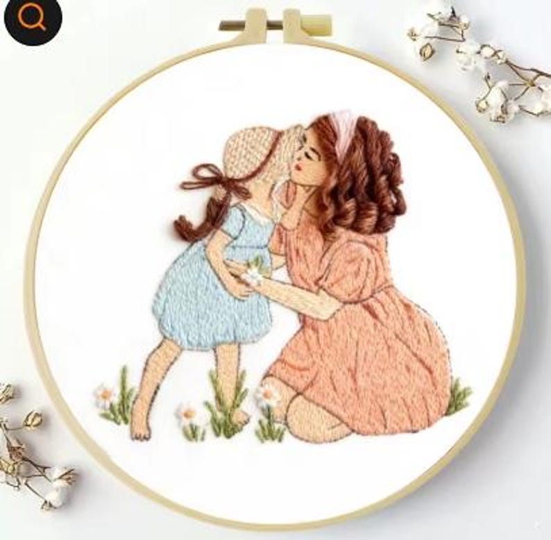 Mother daughter embroidery finished piece on wall