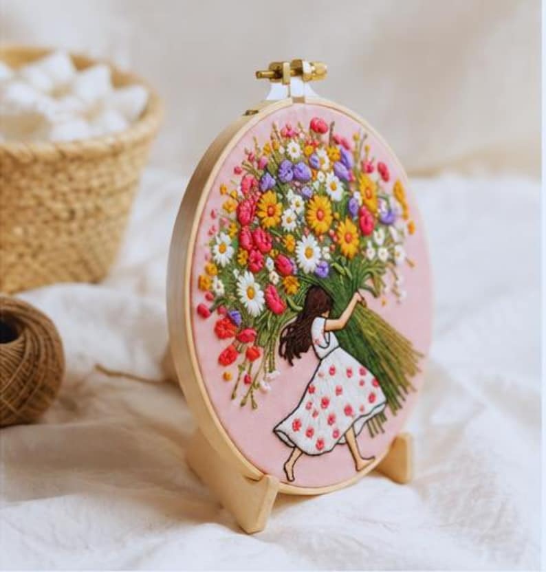 Girl with flowers embroidery kit close up