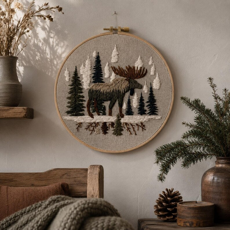 Woodland moose embroidery kit displayed as rustic wall art