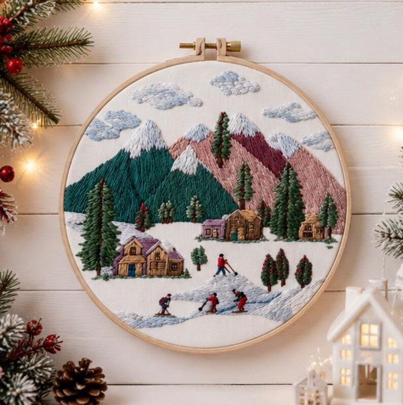 Winter mountain embroidery kit contents with hoop and floss